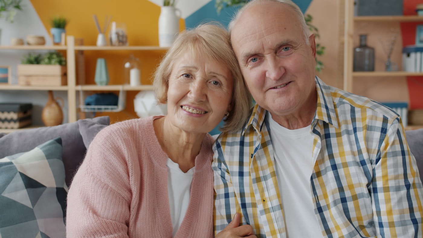 An older couple sharing a peaceful moment at home.