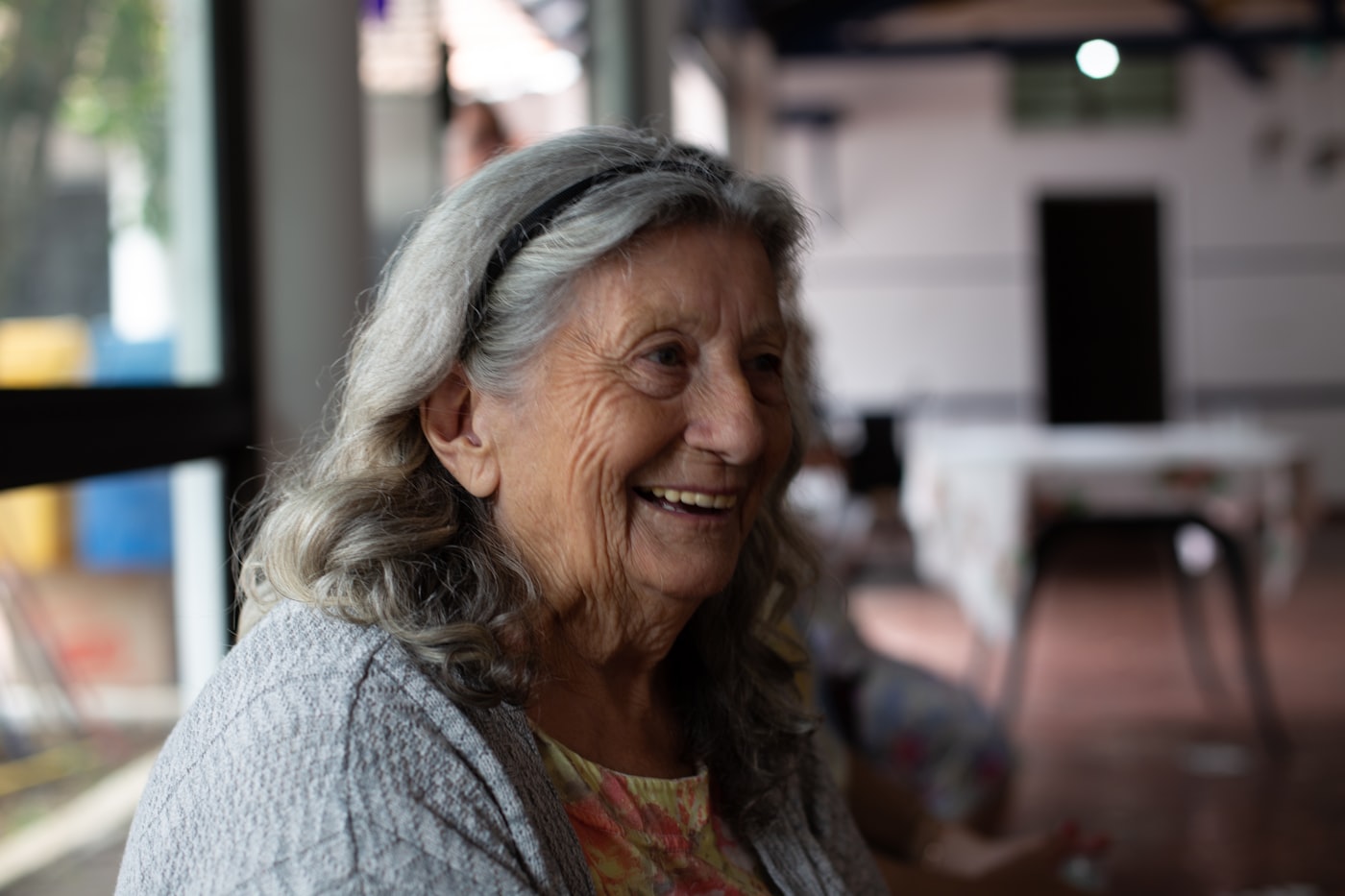 An older adult in a thoughtful, trusting conversation.