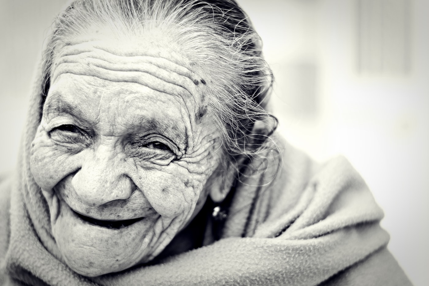 A resident smiling warmly during a conversation.